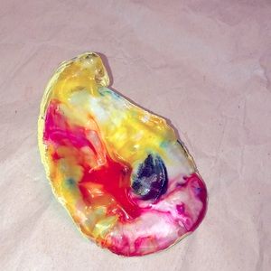 Decorative oyster shell. Can just sit out or use as a jewelry dish.